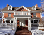 red brick mansion with white columns