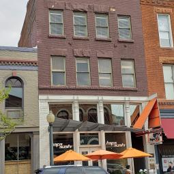 a bus parked in front of a building