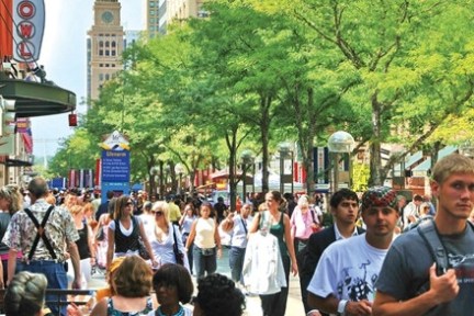 a group of people walking down a street
