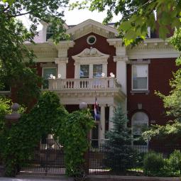 a tree in front of a house
