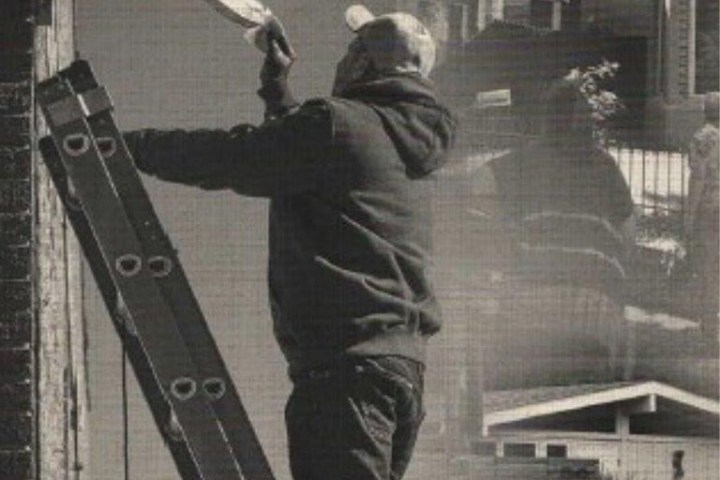 a man standing in front of a building