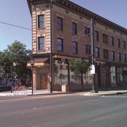 a tall building in the middle of the street