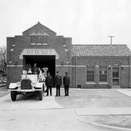 a group of people in front of a building