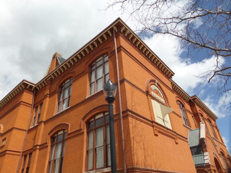 SAM_2444-1024×768 a large brick tower with a clock on the side of a building