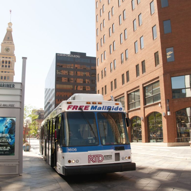 a bus driving down a city street