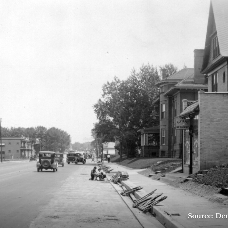 an old photo of a small town street