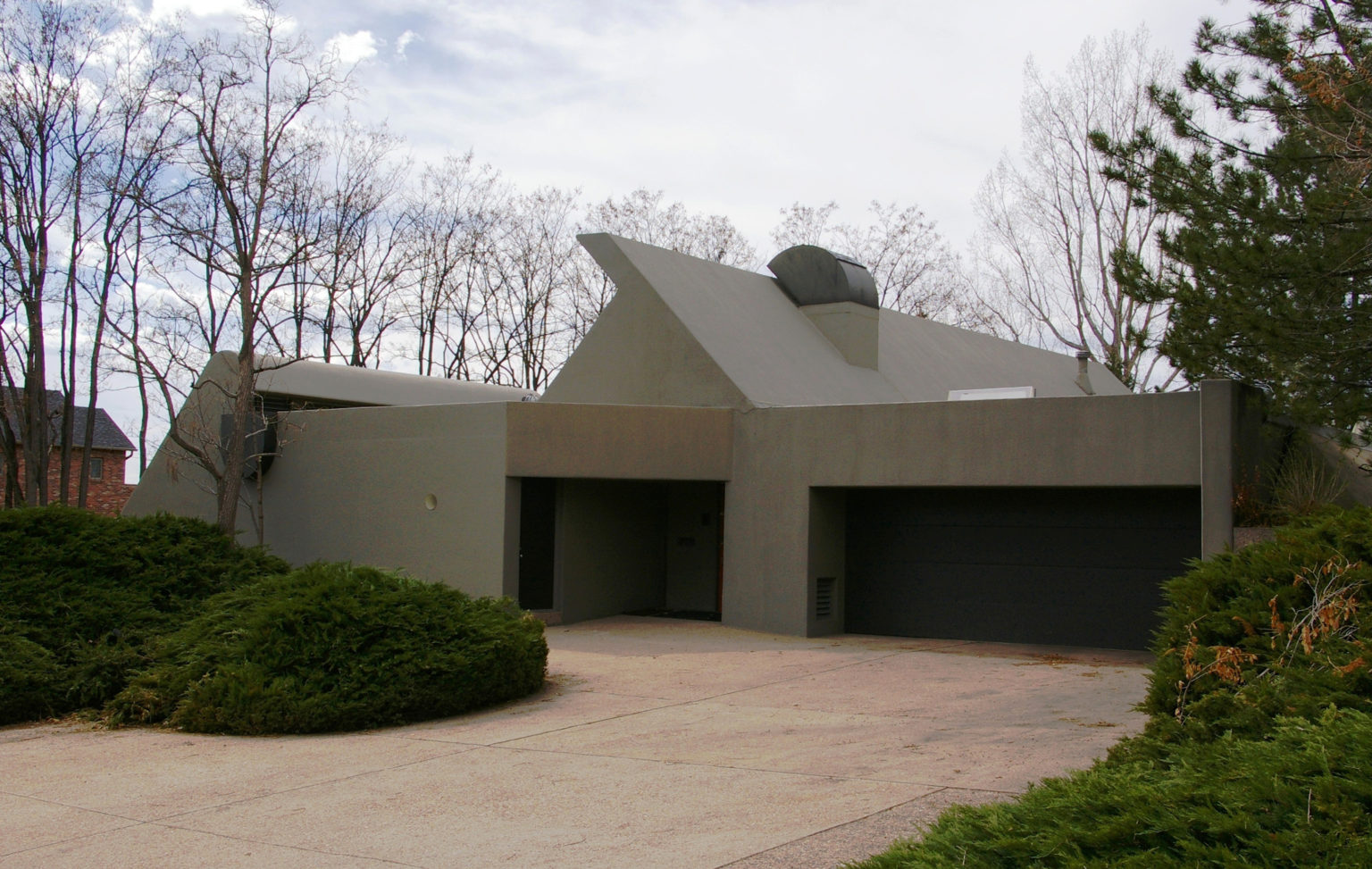 401-Madison-c-1536×973 a house with trees in the background