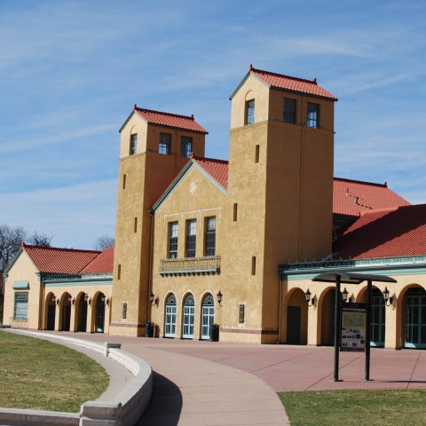 a small clock tower in front of a house