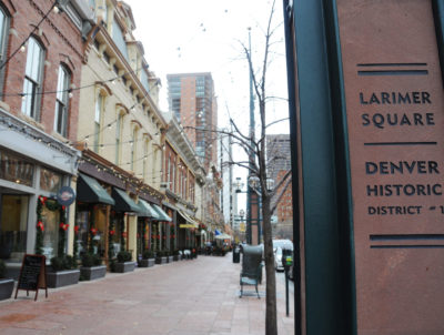Larimer-Sq_post-and-streetscape_November-2015-1-e1491945444743-400×302 a sign on the side of the street