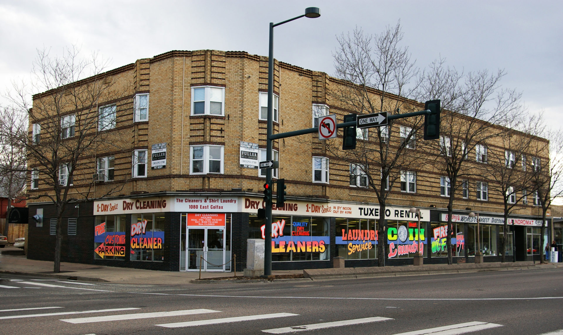 Smileys-e1493826644545 a building with a store on the corner of a street