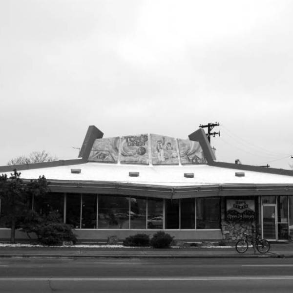 a train is parked on the side of a building