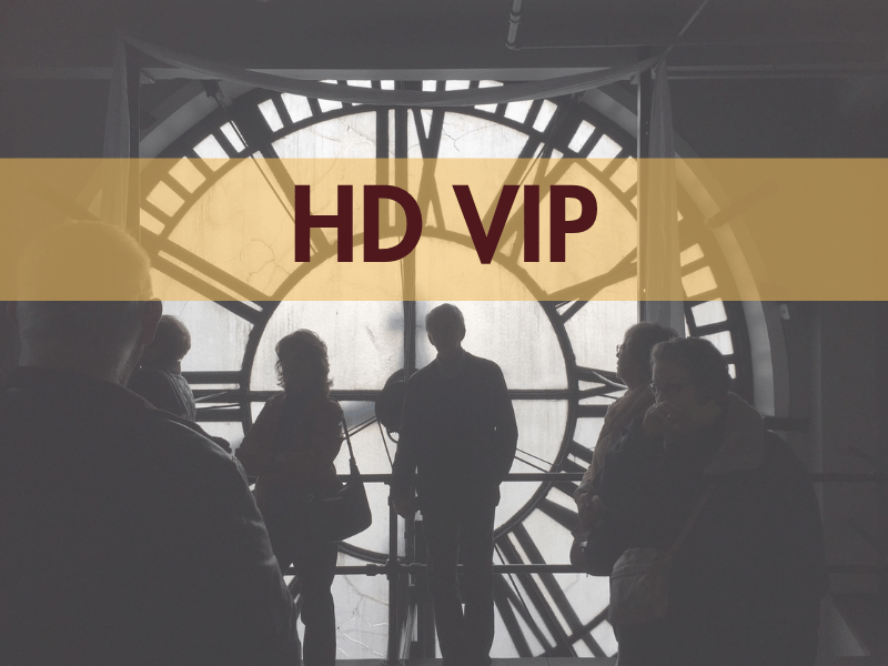 Silhouettes of people in front of a large clock face with 'HD VIP' text overlay.